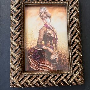 Elegant “Bernadette” jeweled frame. Lt. Smoke Museum gold plate